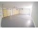 Spacious three car garage with epoxy flooring and plenty of room for storage at 1519 Deerford Cir, Las Vegas, NV 89110