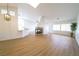 Bright living space with wood-look floors, a fireplace, stylish lighting, and a comfortable atmosphere at 1519 Deerford Cir, Las Vegas, NV 89110