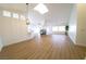 Spacious living area with vaulted ceilings, wood-look flooring, fireplace, and lots of natural light at 1519 Deerford Cir, Las Vegas, NV 89110
