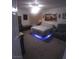 Carpeted bedroom with under bed lighting at 1611 Red Rock Dr, Pahrump, NV 89048