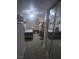 Bright bedroom featuring neutral carpet, ceiling fan, and mirrored closet doors at 1611 Red Rock Dr, Pahrump, NV 89048