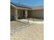 Charming home featuring a front porch, desert landscaping, and solar panels on the roof at 1611 Red Rock Dr, Pahrump, NV 89048