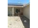 Inviting home featuring desert landscaping, a covered porch, and solar panels on the roof at 1611 Red Rock Dr, Pahrump, NV 89048