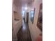 Narrow hallway with laundry appliances at 1611 Red Rock Dr, Pahrump, NV 89048
