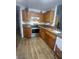 Spacious kitchen featuring natural wood cabinets, stainless steel appliances and flooring at 1611 Red Rock Dr, Pahrump, NV 89048
