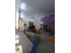 View of cozy living room with flat screen TV, decor, and neutral wall paint at 1611 Red Rock Dr, Pahrump, NV 89048