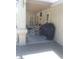 Covered patio area with a table and chairs, plus a barbecue grill at 1611 Red Rock Dr, Pahrump, NV 89048