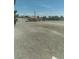 Large gravel yard with a storage shed, fully fenced and landscaped at 1611 Red Rock Dr, Pahrump, NV 89048
