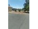 Backyard features mature trees, gravel groundcover, and ample space at 1611 Red Rock Dr, Pahrump, NV 89048