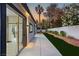 The back of the house with sliding glass doors to the back patio and landscape at 1616 Shadow Rock Dr, Las Vegas, NV 89117