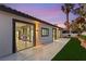 Backyard featuring a concrete patio, privacy wall with beautiful flowers and direct access to living spaces at 1616 Shadow Rock Dr, Las Vegas, NV 89117