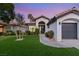Charming single-story home with desert landscaping and a cozy front porch with beautiful, well-maintained lawn at 1616 Shadow Rock Dr, Las Vegas, NV 89117