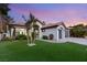 Lovely single-story home boasts a well-manicured lawn, desert landscaping, and a warm color scheme at 1616 Shadow Rock Dr, Las Vegas, NV 89117