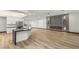 View of modern eat-in kitchen with stone countertops and stainless steel appliances in a wide open space at 1616 Shadow Rock Dr, Las Vegas, NV 89117
