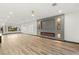 Spacious living room featuring a contemporary fireplace and large windows showcasing the landscaped exterior at 1616 Shadow Rock Dr, Las Vegas, NV 89117