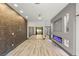 Spacious primary suite with modern electric fireplace and sliding glass door with backyard view at 1616 Shadow Rock Dr, Las Vegas, NV 89117