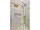 Elegant shower with marble tile, rainfall shower head, and glass door at 1616 Shadow Rock Dr, Las Vegas, NV 89117