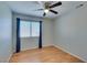 Bedroom featuring hardwood floor, ceiling fan and natural light from a window at 1917 Badger Canyon Ave, North Las Vegas, NV 89031