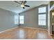 Spacious bedroom with vaulted ceiling, ceiling fan and several windows for light at 1917 Badger Canyon Ave, North Las Vegas, NV 89031
