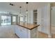 Modern kitchen featuring an island with a butcher block countertop, stainless appliances, and custom cabinetry at 1917 Badger Canyon Ave, North Las Vegas, NV 89031