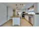 Stylish kitchen with a wood-topped island, stainless appliances, and mosaic tile backsplash at 1917 Badger Canyon Ave, North Las Vegas, NV 89031