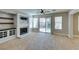 Living room featuring fireplace and sliding glass doors to a backyard at 1917 Badger Canyon Ave, North Las Vegas, NV 89031