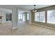 Bright living room with tile flooring, large windows, and neutral color palette at 1917 Badger Canyon Ave, North Las Vegas, NV 89031