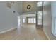Spacious living room featuring tile floors, high ceilings, and large windows for plenty of natural light at 1917 Badger Canyon Ave, North Las Vegas, NV 89031