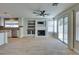 Living room featuring a fireplace, stainless appliances, and sliding door to outside at 1917 Badger Canyon Ave, North Las Vegas, NV 89031