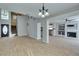 Open-concept living area with fireplace, kitchen, and tiled flooring at 1917 Badger Canyon Ave, North Las Vegas, NV 89031