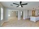 Bright living room with open floor plan, tile floors, a modern ceiling fan, and recessed lighting at 1917 Badger Canyon Ave, North Las Vegas, NV 89031