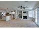 Open-concept kitchen and living room with fireplace and stainless steel appliances at 1917 Badger Canyon Ave, North Las Vegas, NV 89031