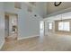 Spacious living room featuring tile floors, high ceilings, and large windows for plenty of natural light at 1917 Badger Canyon Ave, North Las Vegas, NV 89031