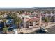 Community showcasing a multi-story condo with a tile roof, surrounded by palm trees and parking lots at 1928 Las Palmas Ln # 228, Laughlin, NV 89029