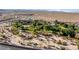 Aerial view showcasing playground and baseball field next to desert landscape at 1928 Las Palmas Ln # 228, Laughlin, NV 89029