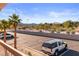 Balcony with desert landscaping and parking, under sunny blue skies at 1928 Las Palmas Ln # 228, Laughlin, NV 89029