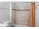 Bathtub with a shower curtain, tiled wall, and a shower head at 1928 Las Palmas Ln # 228, Laughlin, NV 89029
