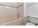 Bathroom with a bathtub, tiled wall, and a toilet at 1928 Las Palmas Ln # 228, Laughlin, NV 89029