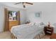 Bedroom with a bed, nightstands, and a window with a palm tree view at 1928 Las Palmas Ln # 228, Laughlin, NV 89029
