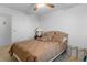 Warm bedroom with an inviting bed, side table, and ceiling fan, providing a cozy and peaceful retreat at 1928 Las Palmas Ln # 228, Laughlin, NV 89029