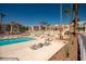 Relaxing community pool and common areas with lounge chairs and desert landscaping and lounge chairs at 1928 Las Palmas Ln # 228, Laughlin, NV 89029