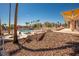 Resort style community pool and jacuzzi with shade structures, landscaping, and seating area at 1928 Las Palmas Ln # 228, Laughlin, NV 89029