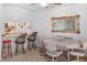 Cozy dining area with a mirror and breakfast bar that provides seating and opens to the kitchen space at 1928 Las Palmas Ln # 228, Laughlin, NV 89029
