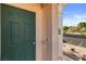 This image shows the front door to the condo along with the view to the parking lot at 1928 Las Palmas Ln # 228, Laughlin, NV 89029