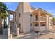 Exterior view showcasing private balconies and unit entrances, with desert landscaping at 1928 Las Palmas Ln # 228, Laughlin, NV 89029