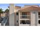 Exterior view showcasing stucco siding, a red tile roof, and a cozy balcony at 1928 Las Palmas Ln # 228, Laughlin, NV 89029