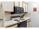 Functional kitchen with white countertops, a built-in microwave, and a range with a black oven door at 1928 Las Palmas Ln # 228, Laughlin, NV 89029