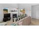 Bright living room with a fireplace, large windows, and comfortable seating, ideal for relaxation at 1928 Las Palmas Ln # 228, Laughlin, NV 89029