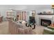 Cozy living room with fireplace, blending seamlessly into dining area with modern furnishings and natural light at 1928 Las Palmas Ln # 228, Laughlin, NV 89029