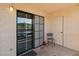 Outdoor patio area with sliding glass doors and a small area for seating at 1928 Las Palmas Ln # 228, Laughlin, NV 89029